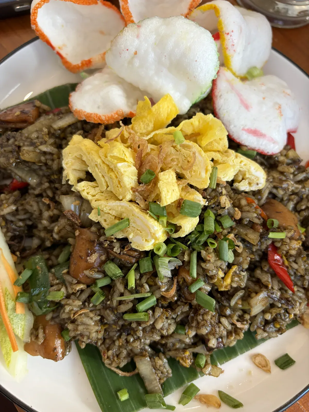 Indonesian seafood nasi goreng with crackers.